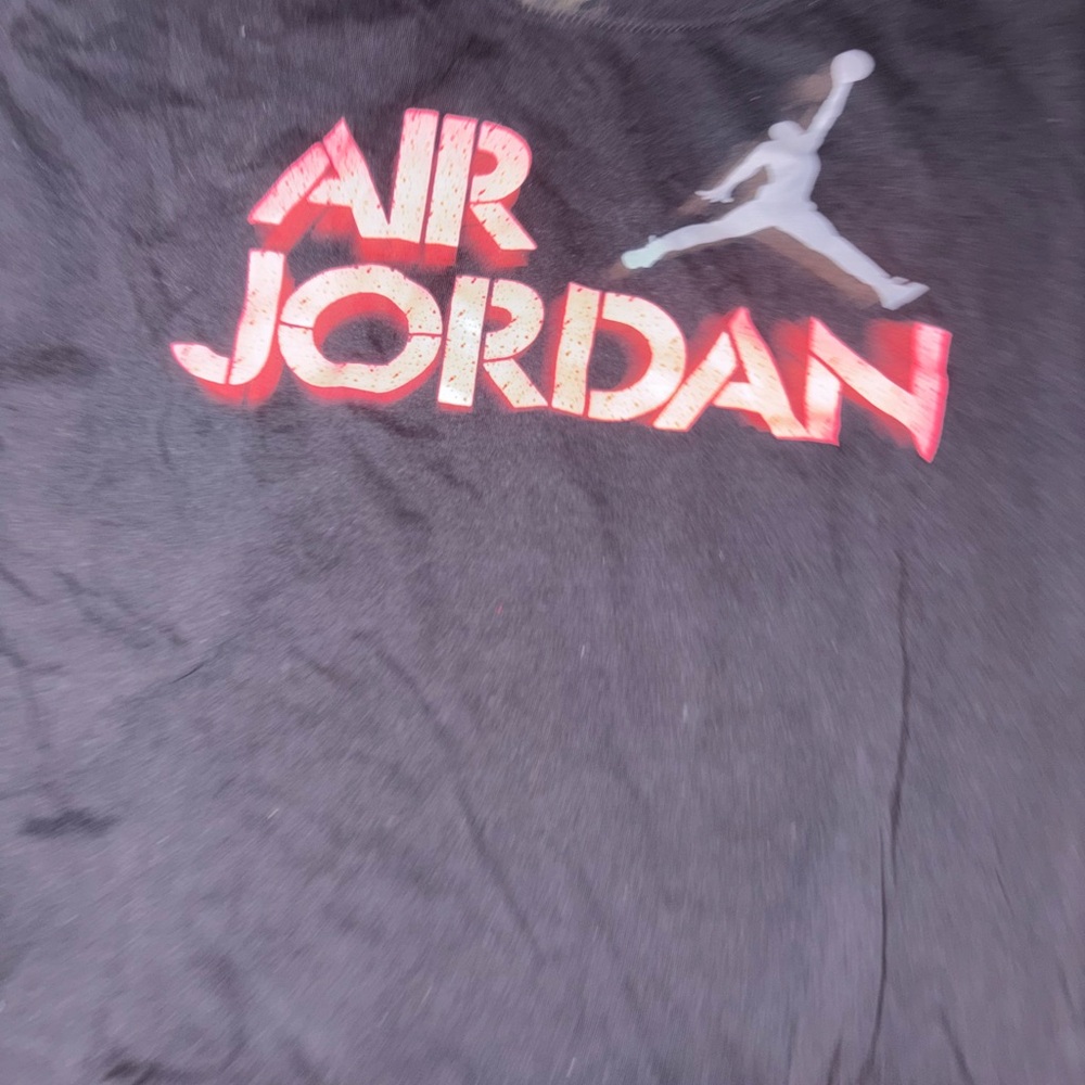 Jordan Black and Red Kids Short Sleeve Tee fits like a regular women large